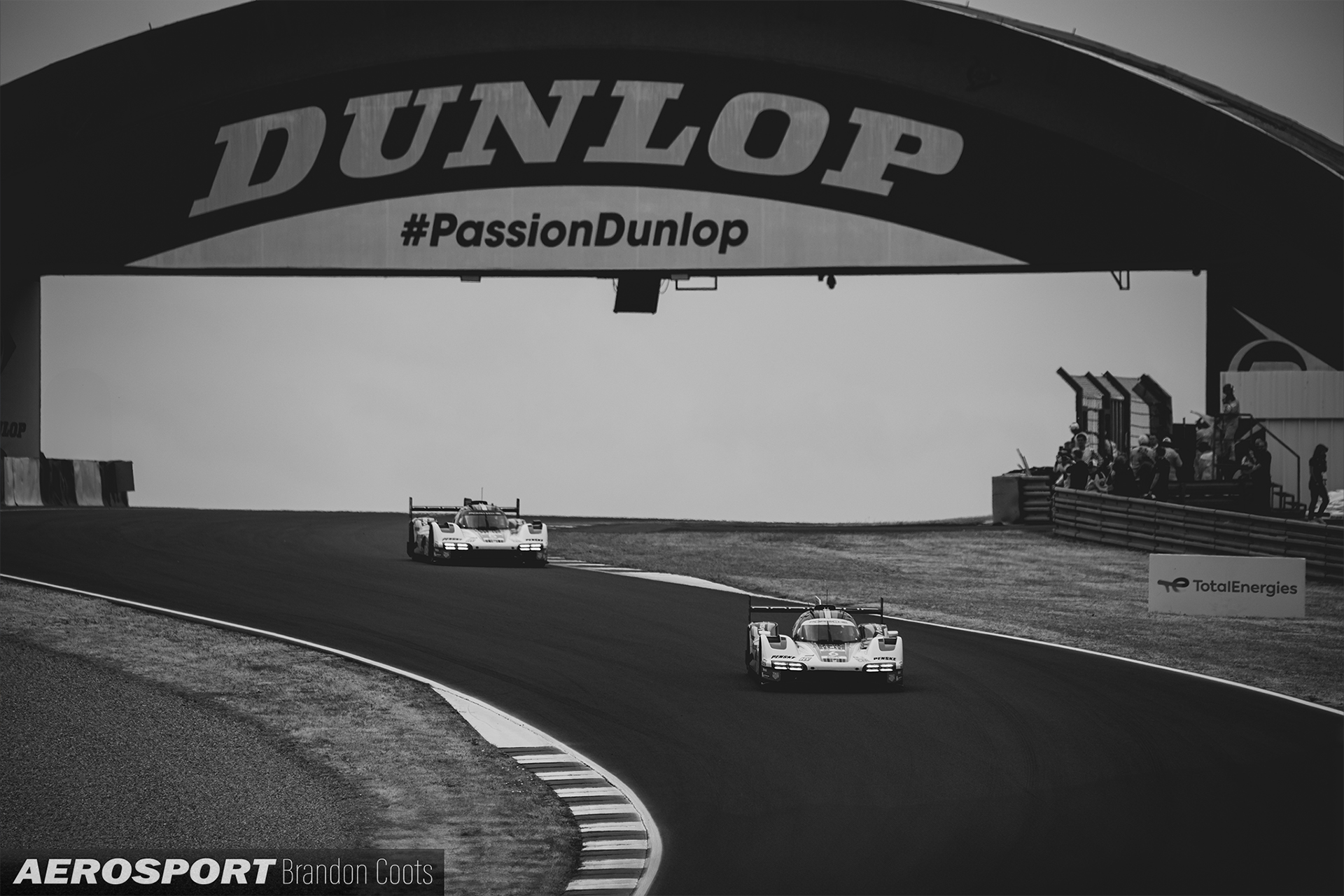 Pair of 2 Porsche Penske Motorsport Porsche 963 passing under the Dunlop Bridge at 2023 24 Hours of Le Mans