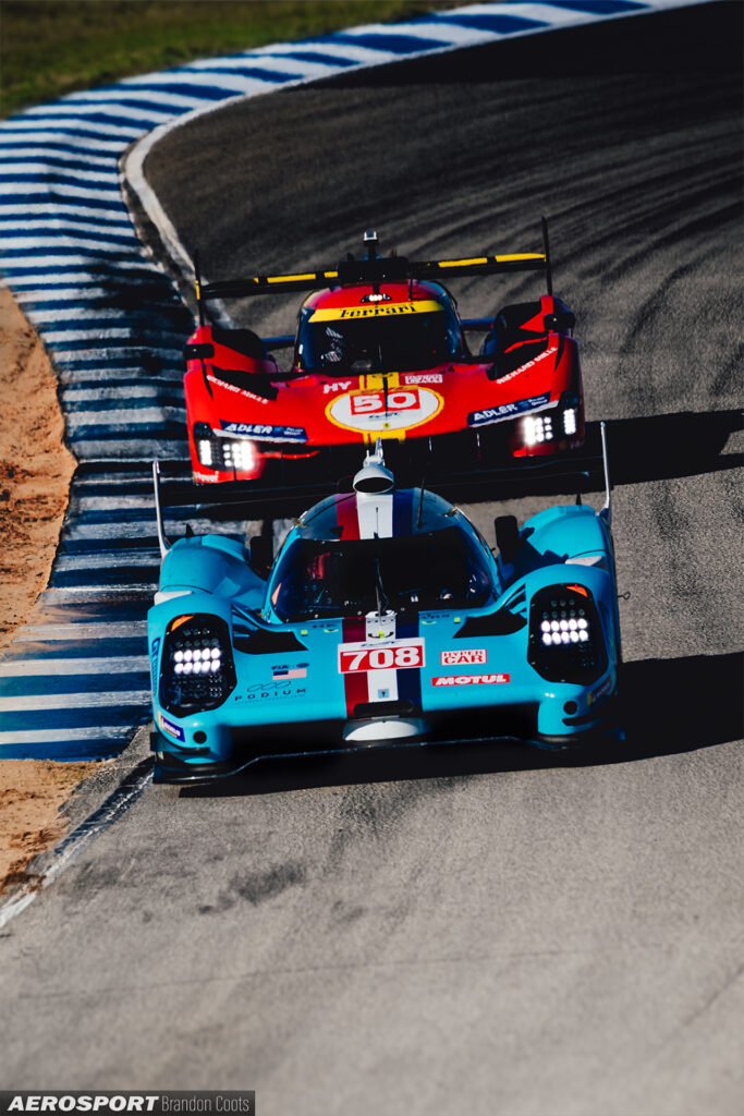 Glickenhaus #708 SCG 007 Hypercar alongside Ferrari 499P #50 Hypercar at FIA WEC 1000 Miles at Sebring